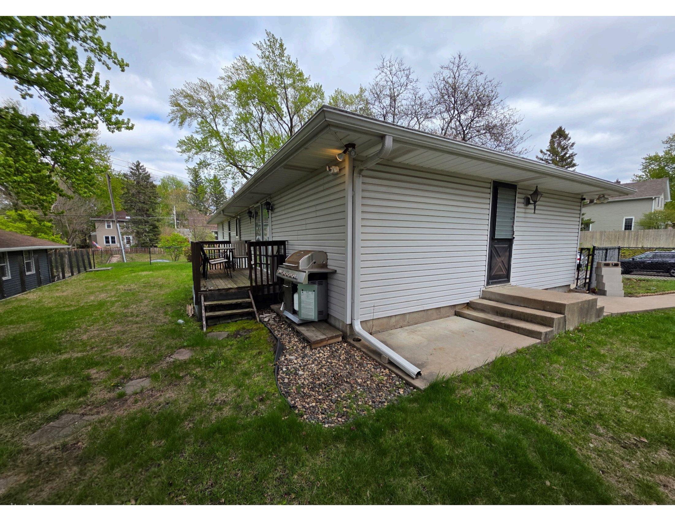 Back deck with a grill - where residents gather for meals outdoors