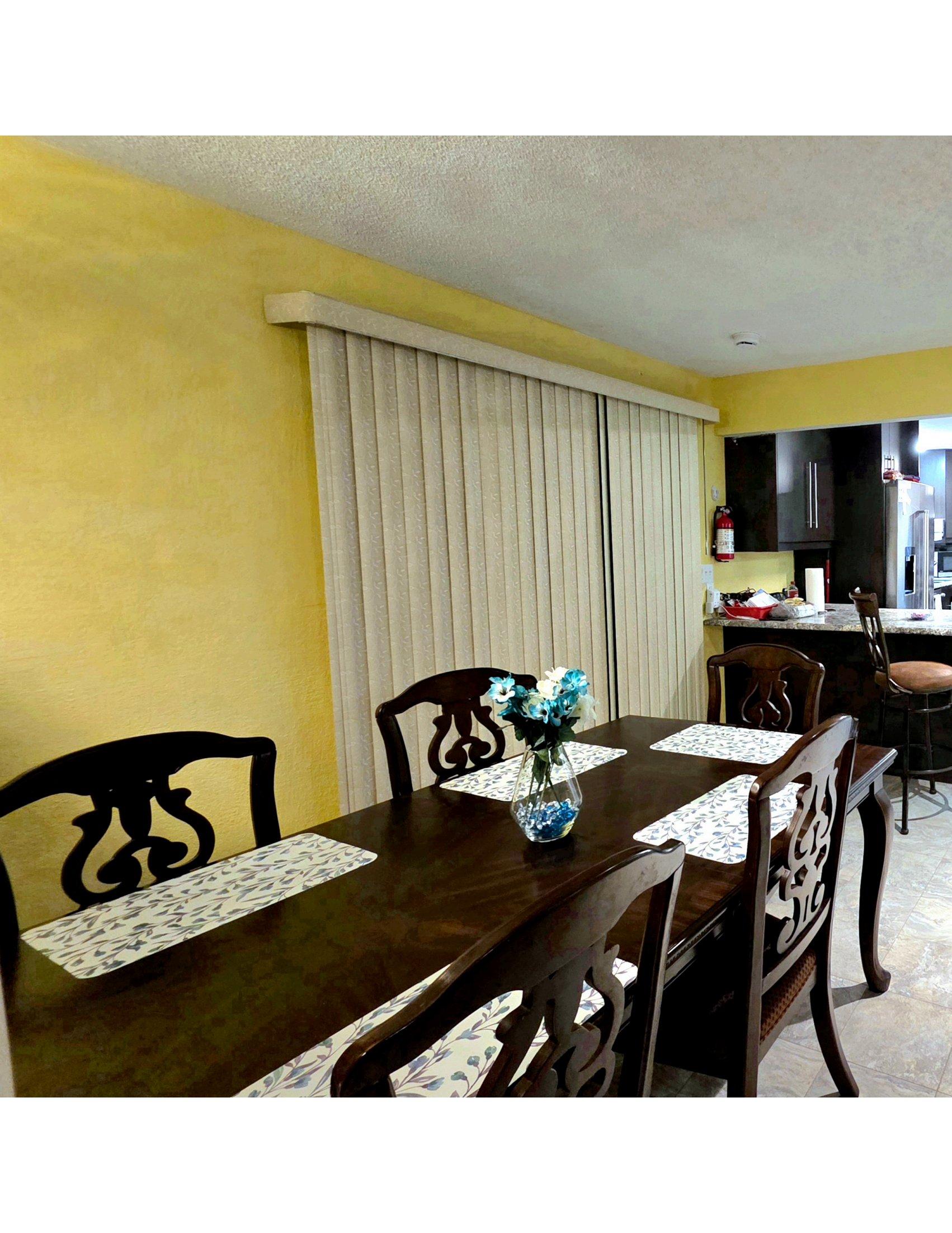 The dining area inside the residence, set with fresh flowers